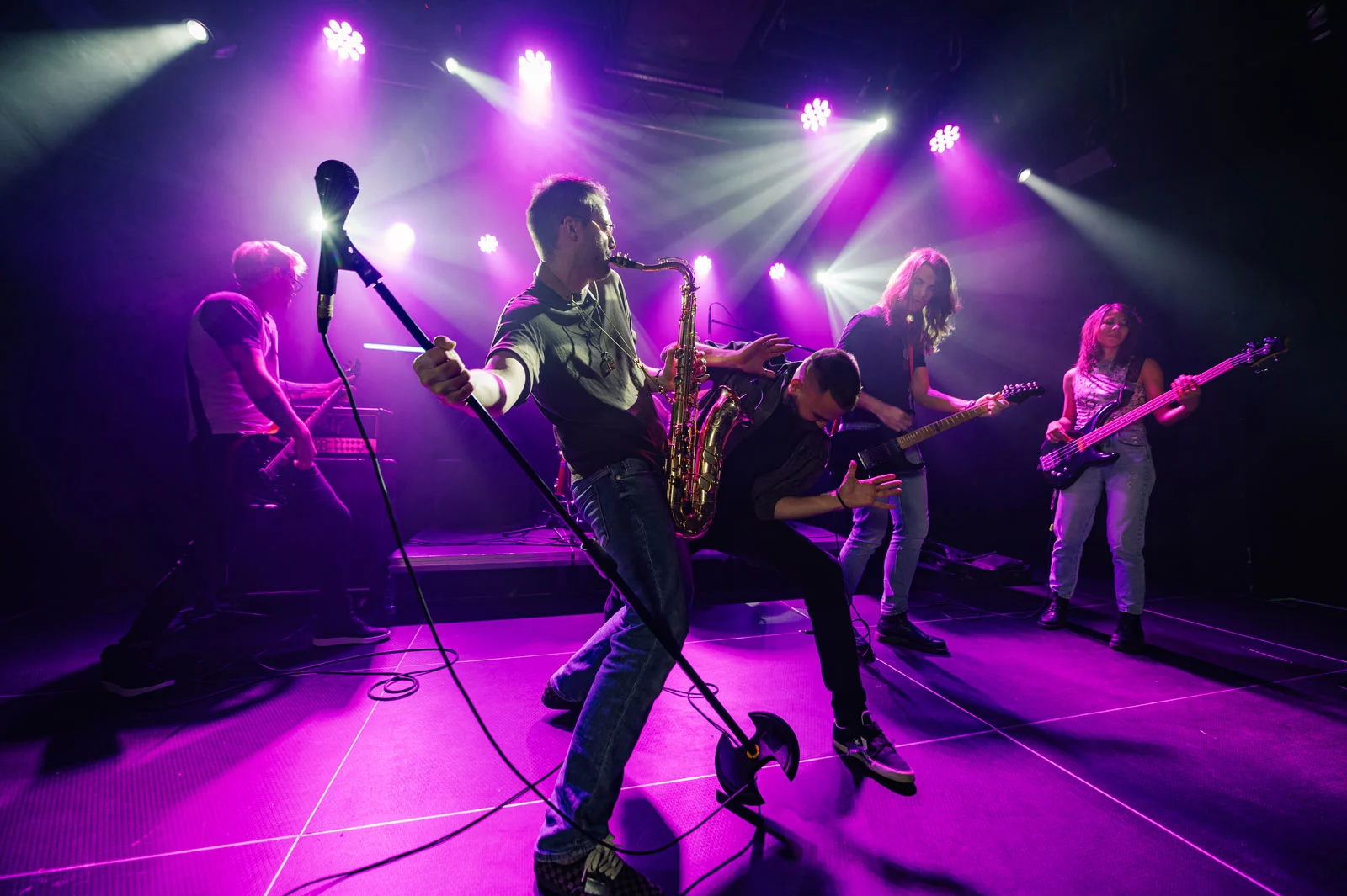 music-band-playing-live-on-stage-with-purple-light-2025-04-03-20-04-09-utc2.webp